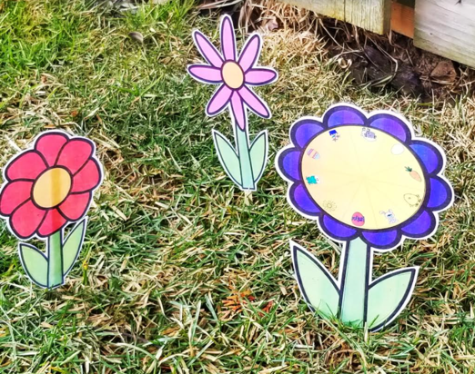 spring escape room shows three flowers in the grass.
