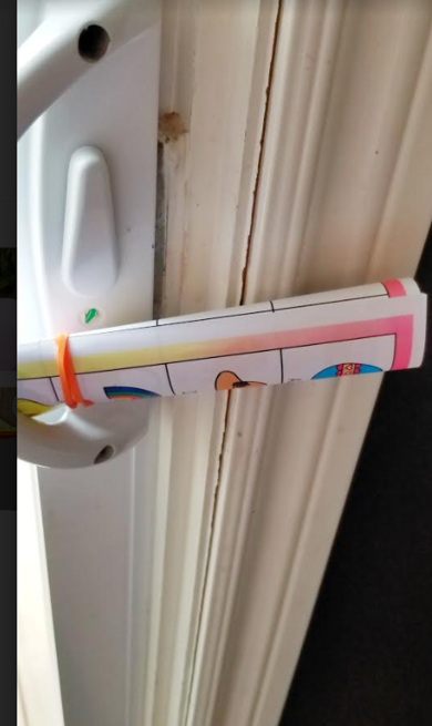 easter games for kids shows a printed puzzle stuck in a door handle.