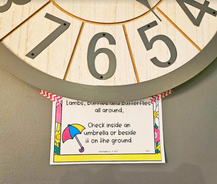 treasure hunt for kids shows a printed riddle taped below a clock.