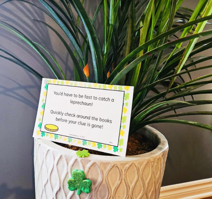 scavenger hunt shows a plant with a printed clue set inside it.