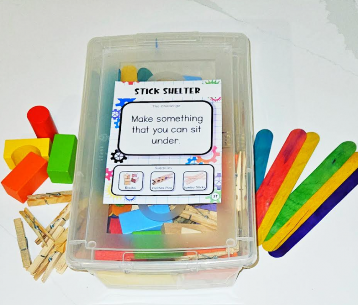 simple STEM Activities shows a bin with materials inside and popsicle sticks, blocks and pins beside it.
