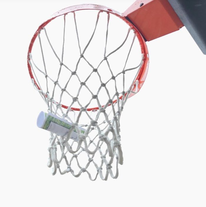 outdoor activity shows a basketball net with a rolled up sheet of paper in the net.
