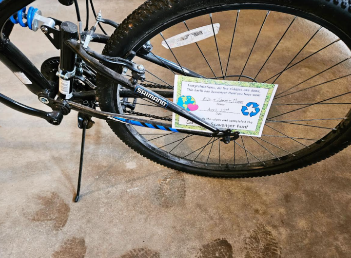 outdoor activity for kids shows a riddle on a bike.