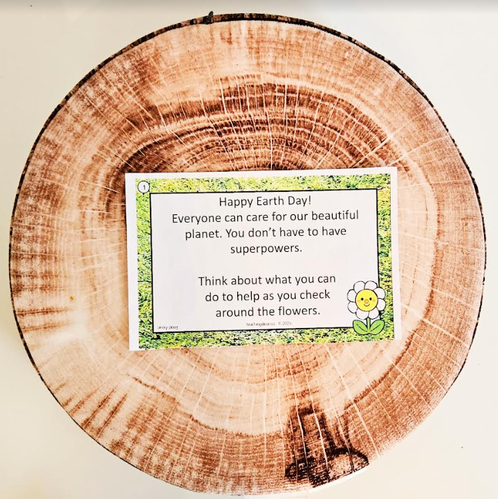 free printable earth day scavenger hunt shows a clue on a wooden log.