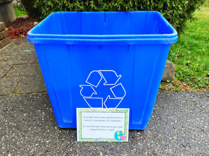 earth day activity shows a blue box with a sheet of paper with a riddle set on it.