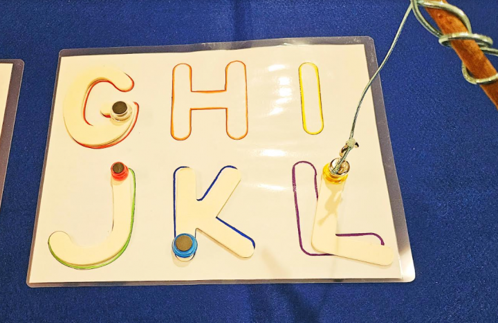 letter game for preschool shows a printed mat that has the letters GHIJKL.