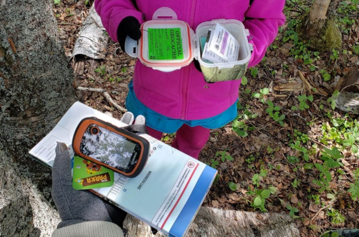 fun map activities show a child with mapping things like a compass and a kit for outdoors.
