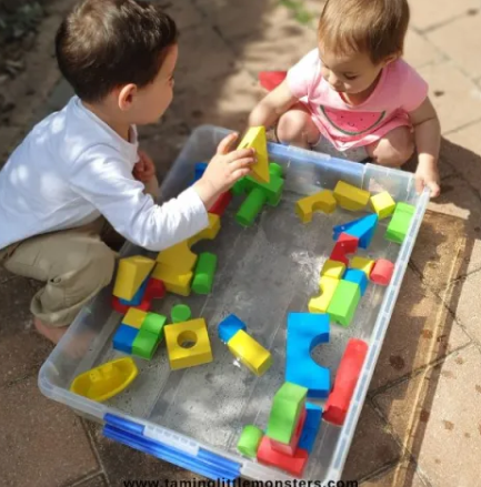 Summer Outdoor Learning Activities shows children playing in water and foam building blocks.