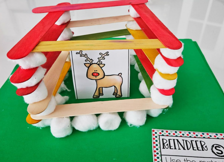 holiday stem challenges shows a reindeer character inside a popsicle stick and cotton ball structure.