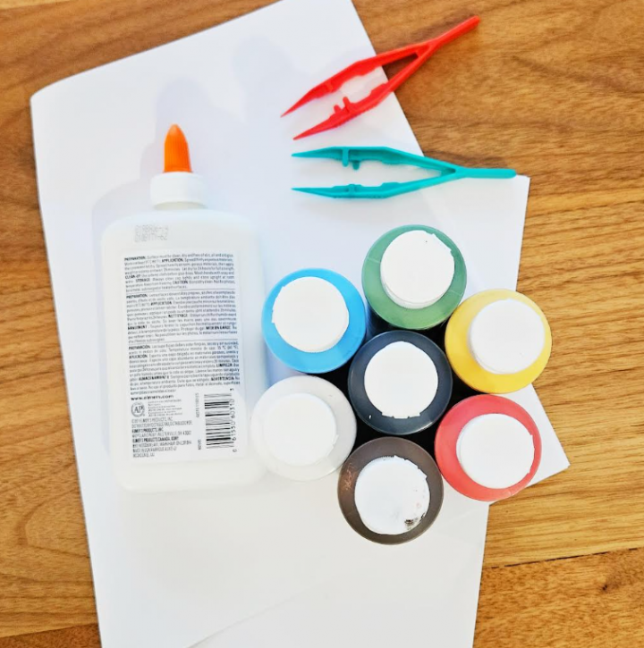 easy paper mache art project shows materials needed for the project. It shows paint, glue and paper.