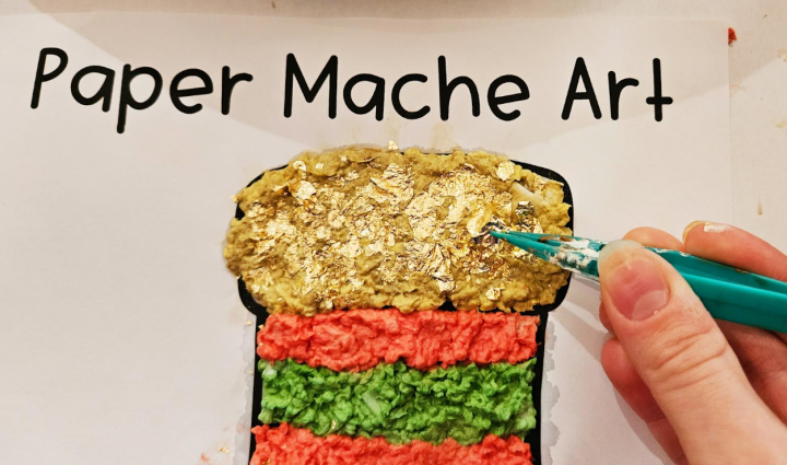 stocking craft for kids shows a child adding gold foil onto a Christmas stocking craft.