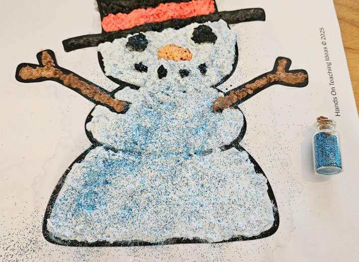winter art for kids shows a snowman with sprinkles over it.