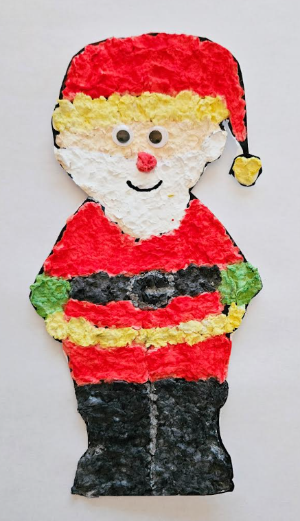 Christmas art project shows a Santa image made with paper mache.