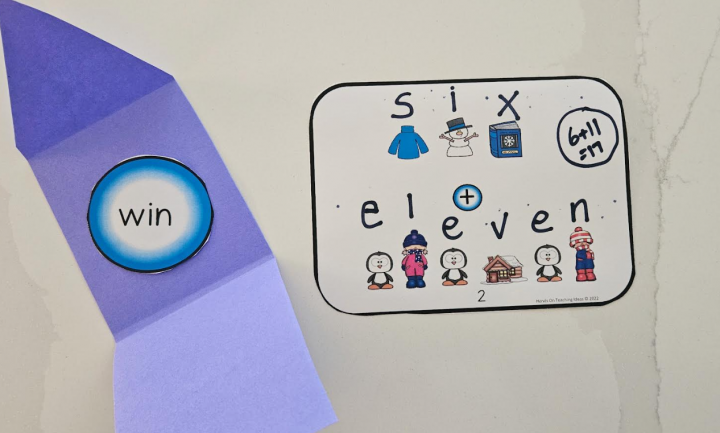 puzzle game for kids shows an answer card with the clue six plus eleven and an envelope with the word win.