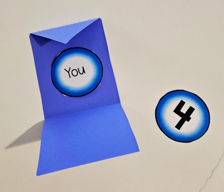 free winter escape room game shows an envelope with the word you inside and the number 4 beside it.