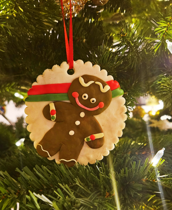 Christmas ornament for kids shows a gingerbread ornament made by a child.