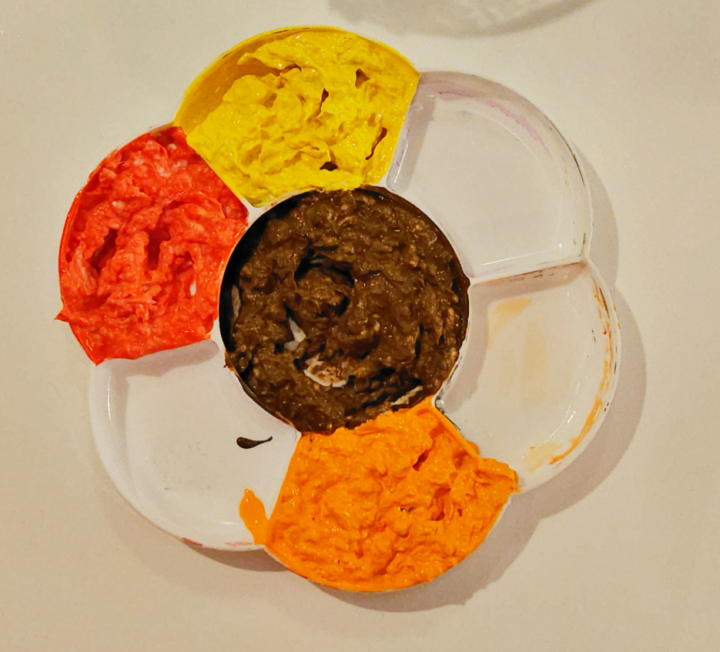 thanksgiving paper mache art shows paper pulp in red, orange, yellow and brown.