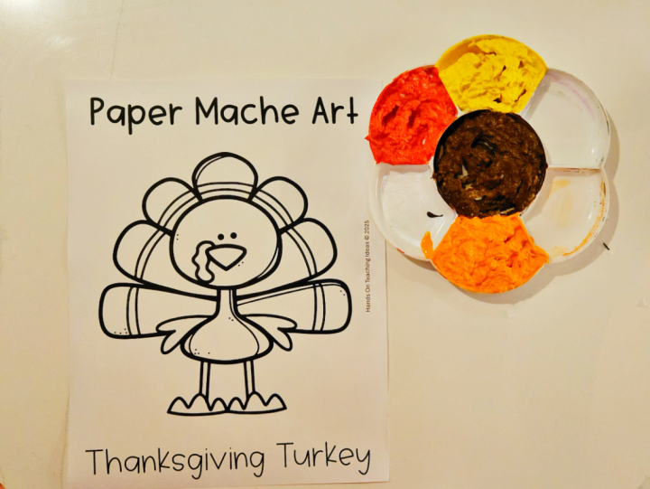 Thanksgiving art shows a printed page with a turkey image and a container with various colored paper pulp.