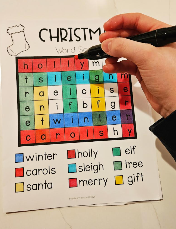 Free December activity calendar for kids shows a child completing a Christmas word search.
