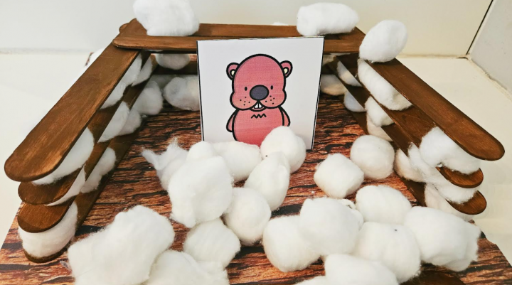 free groundhog day STEM shows a picture of a groundhog in a structure made by a child.