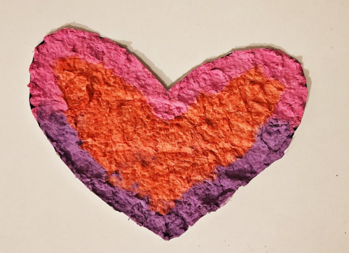 free valentines day paper mache activity shows a Valentine heart that has dried and looks textured.