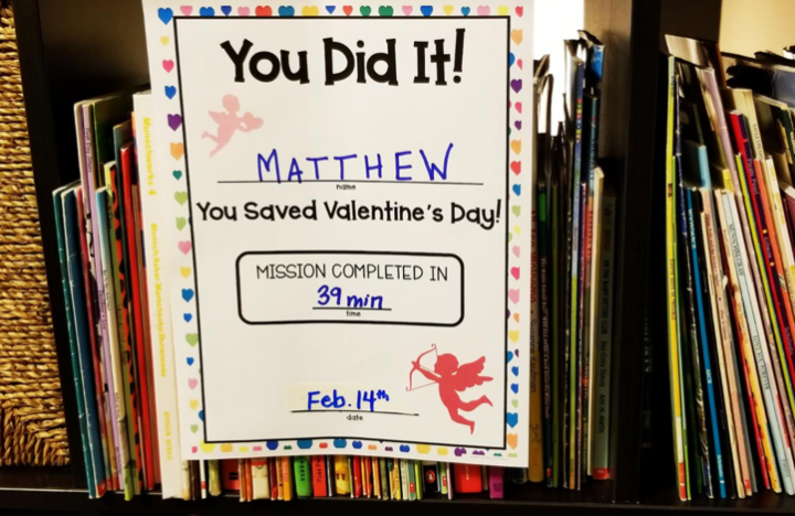 escape room completion certificate shows a page placed in a bookcase.