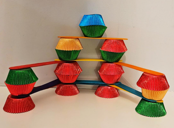 no prep STEM challenge for kids shows a tower made from cupcakes and popsicle sticks.