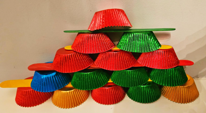 no prep STEM challenge for kids shows a tower made from cupcake liners.