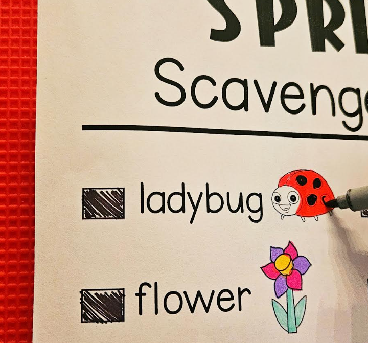 spring activity for kids shows part of a scavenger hunt checklist and a child coloring a ladybug on the page.