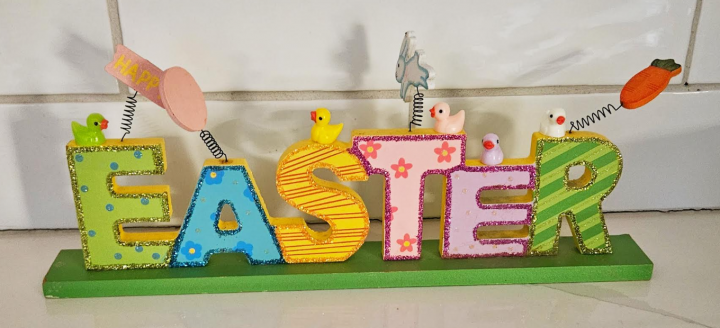 Free Easter scavenger hunt for kids shows an Easter decoration with mini ducks on the letters.