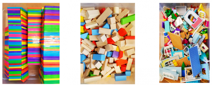 engineering challenge for kids shows three full bins of materials to build with like wooden blocks and magnetic tiles.