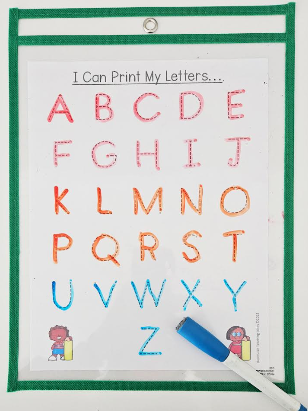 letter printing shows a page with the letters of the alphabet that have each been traced with marker.