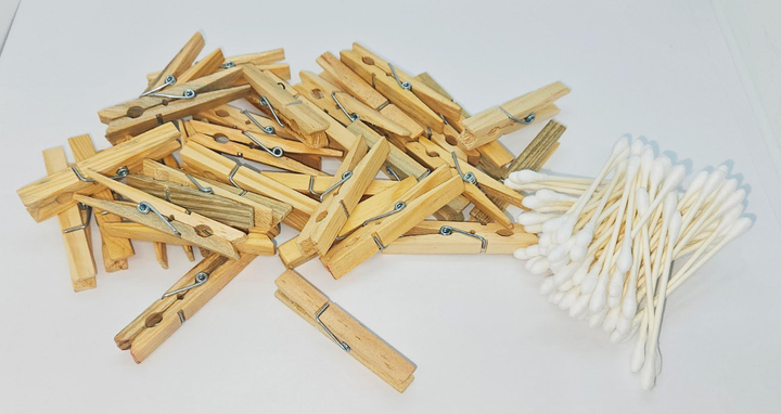 STEM materials shows clothes pins and cotton swabs.